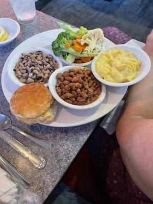 Veggie platter with biscuit.