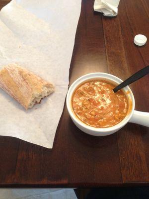 Lasagna inspired soup with a fresh baguette half