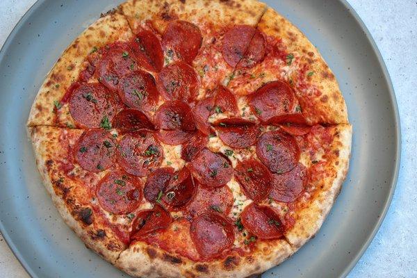 Sweet & Spicy Pepperoni Pizza made in our wood-fired oven