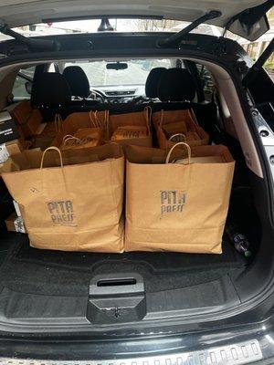 SUV filled with with food for catering event. Private messenger services