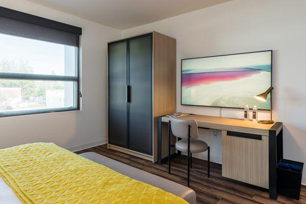 Full-size desks, unlimited bottled water, and 65" HD televisions in all the AND guestrooms