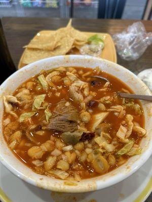 Pozole rojo with pork. Comes with onion, cabbage, lemon, chiles and oregano on the side that you can add