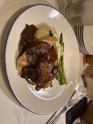 From brio Chicken with mashed potatoes and mushroom sauce with a side of asparagus