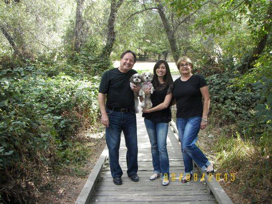 Dr. Russo with his dogs (Jax & Chloe) and his  office staff (Lani & Elizabeth).