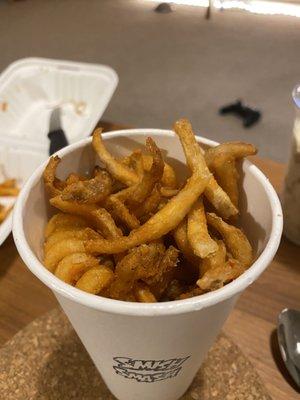 A huge cup of curly fries