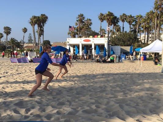 WC BEACH athletes preparing for serve receive.