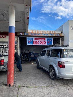 My vehicle getting its smog service.