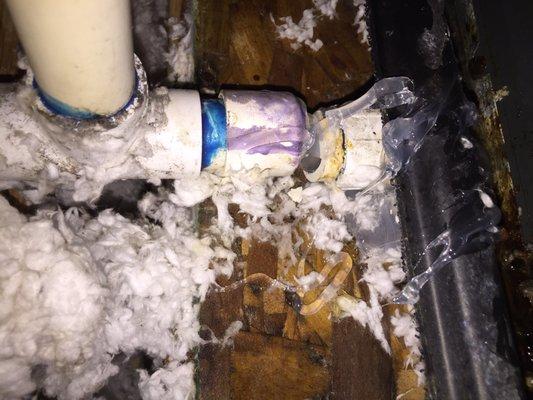 It appears the repair person broke a pipe from the drainage pan, and tried to fix it with caulk.