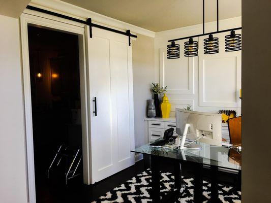 Shadow boxes + sliding barn door added to give this office space some more character