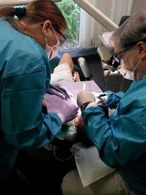 Dr. Jeff Matilsky and his wife, Debbie, helping a patient.