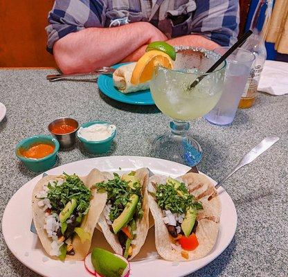 Tacos El Sur, large spicy jalapeño margarita, Chipotle salsa, Mexicana salsa, sour cream for our plantains, and a chicken burrito for Vinny!