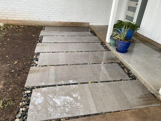 Installation of slabs with some washed river rock and some Arizona pebble