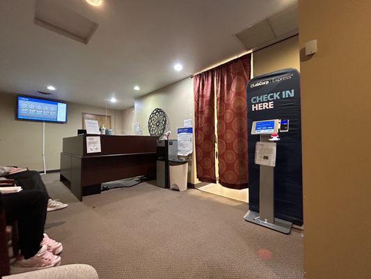 This is it, front desk and waiting room. Lab room is behind the curtains, you can hear everything!