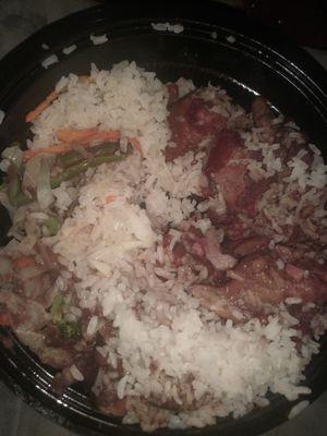 Stew peas (pork) white rice veggies and somewhere beneath all the food is sweet fried plantains. So good and plentiful.