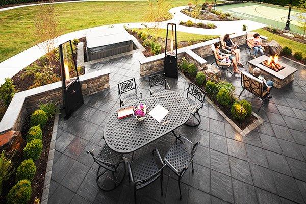 A sunken hot tub and paver patio  for relaxation and family time.