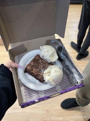 2 scoops of cookies and cream Ice Cream on a Brownie