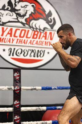 student training in boxing ring