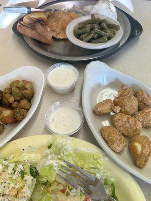 Okra. Corn nuggets.   Side salad with ranch.   Mashed potatoes with Texas toast, green beans, and chicken