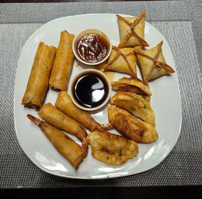 Chicken eggrolls, shrimp blankets, dumplings, and crab rangoon