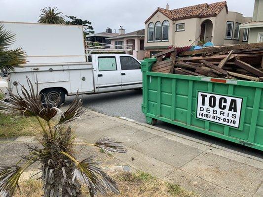 Truck with extra load to be hauled away