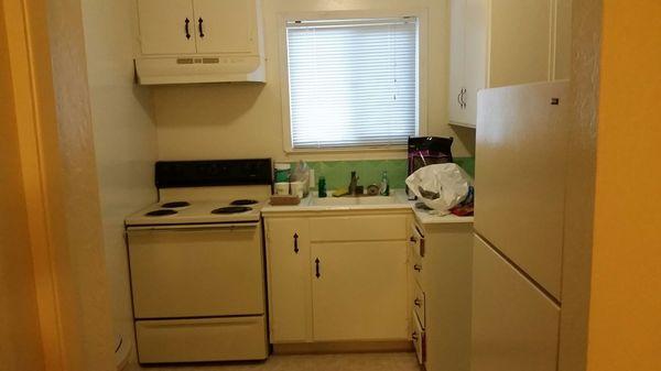 Kitchen, includes stove and fridge.