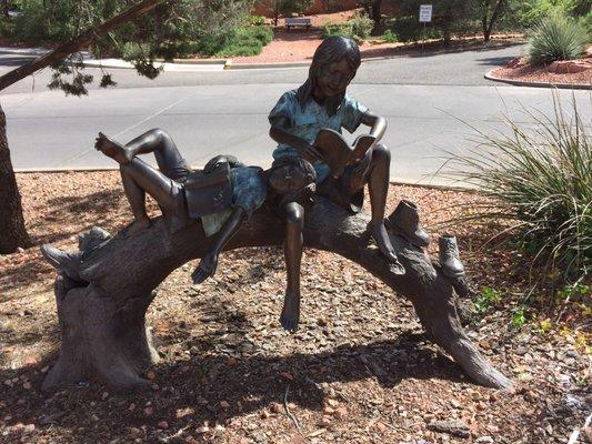 Nice bronze of children readings BOOKS not text messages!