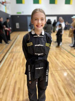 Earning her Youth Black Belt!