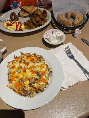 Christians low carb special (I added hot sauce on top), a piece of cinnamon sugar fried dough, 2 Eggs w/ Meat, Potato, & Toast