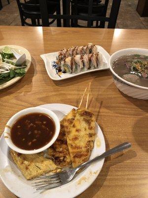 Small combination pho, shrimp tempura roll, and chicken satay.