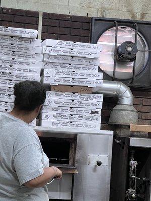 Pizza order boxes stacked