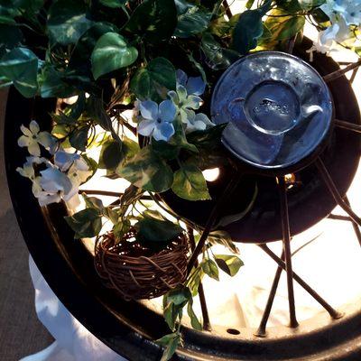 Repurposed antique car tire rim into a decorative lamp.