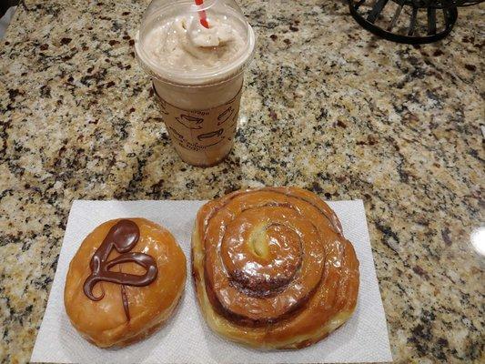 Chocolate cream filled on the left and a cinnamon roll.