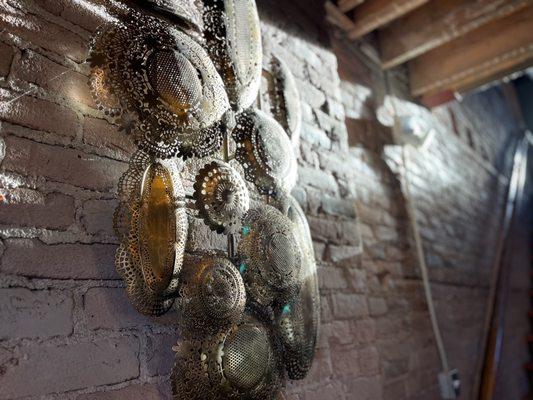 Next to the stairs was beautiful wall decor over old brick with stunning natural light.