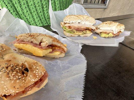 Ham egg and cheese bagel, and a California bagel with avocado, tomato, bacon, turkey, cream cheese