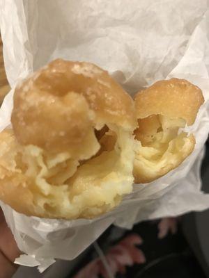 French donut. Raw and soggy inside. Gross