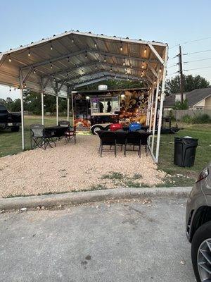 Outside eating area and food truck location.