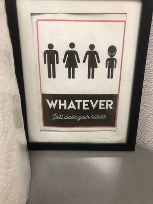 Funny sign in the bathroom.