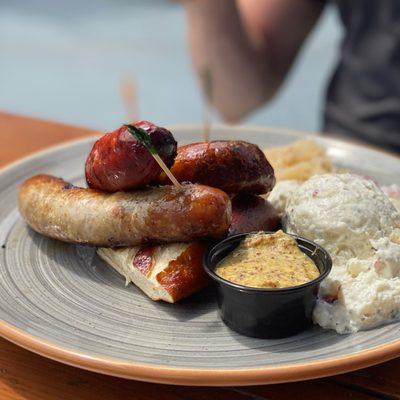 Sausage Sampler (bratwurst, keilbasa, wurzigwurst, potato salad, sauerkraut) spicy mustard