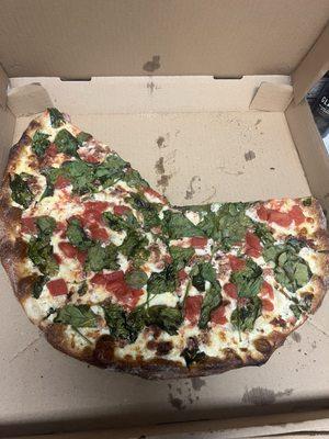 Forgot to take a photo before digging in. White pie with spinach, tomato, and bacon. Incredible!!!