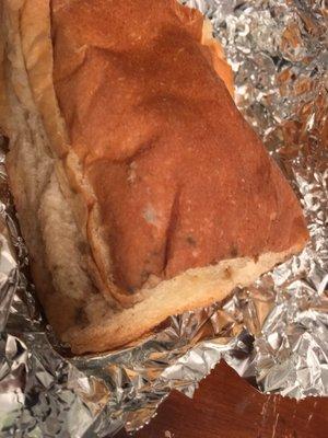 This was the bread I received today with my meal. Mold spores of two different varieties dotted the side of the bread.