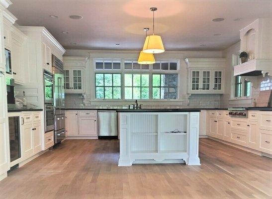 Painting of kitchen cabinetry.