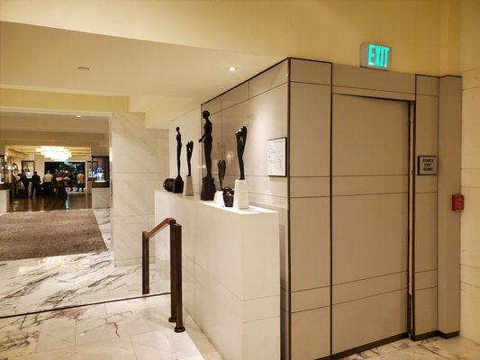 The holy grail: the camouflaged entrance to the stairs that run the whole height of the building. (To the left is the main front doors.)