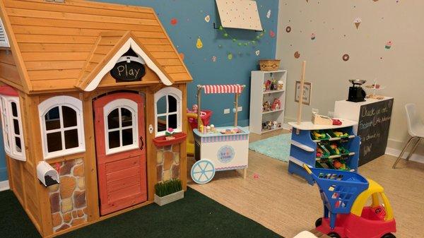 Cute playhouse and grocery store.