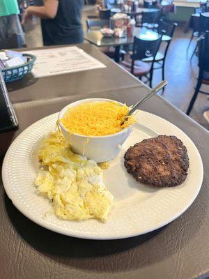 Two egg breakfast with grits and hot sausage