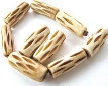 Carved bone tube beads