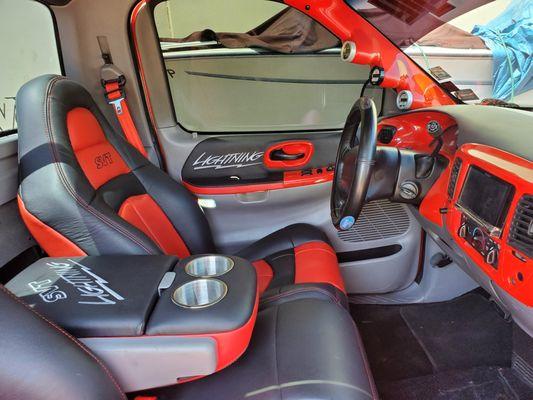 Leather seat with svt logo and custom center arm rest with cups holders.