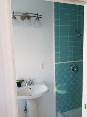 Pedestal sink installed in new bathroom