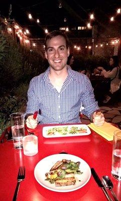 Husband enjoying dinner at Poppy