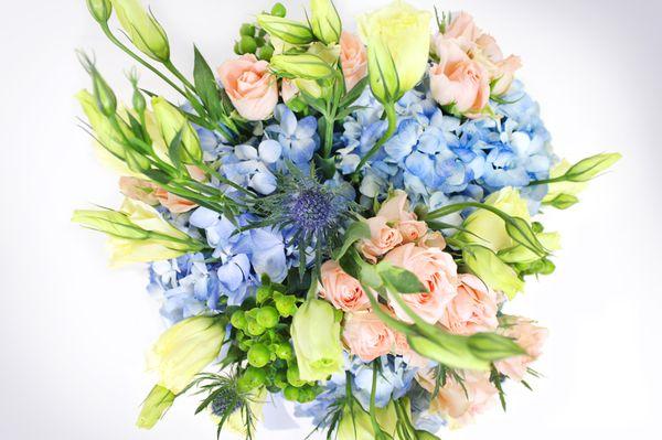 Flowers: Blue Hydrangea, Creamy Lisianthus, Light Peach Spray Roses