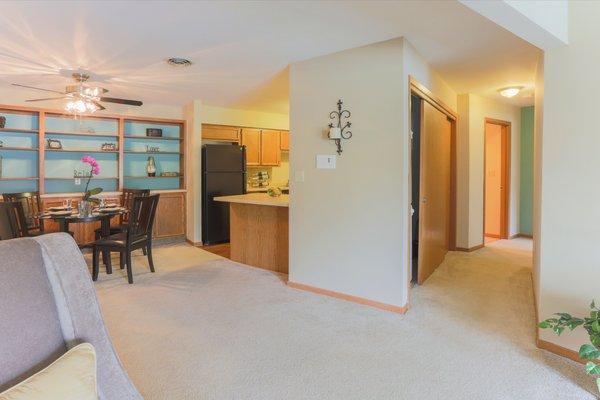 Living room facing dining room, kitchen and hallway